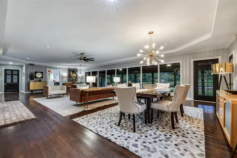 a outdoor space with lots of tables a garden and chairs