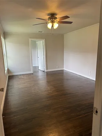 a view of a field with trees in front of it