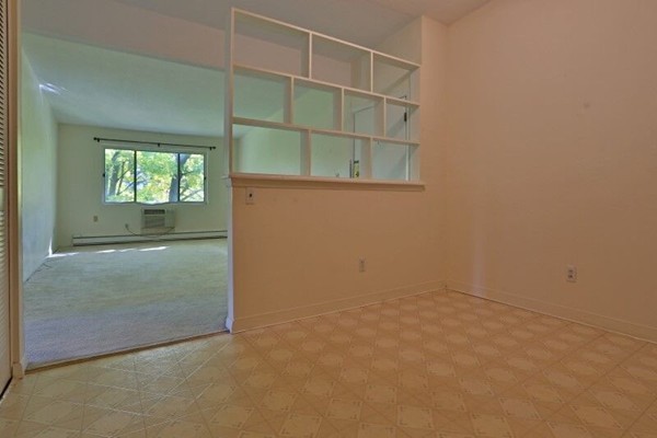 74 Beach Street, Unit 211 Woburn, MA 01801 - Photo 4 of 14 an empty room with windows