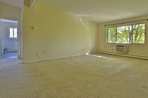 74 Beach Street, Unit 211 Woburn, MA 01801 - Photo 6 of 14 an empty room with a empty space and windows