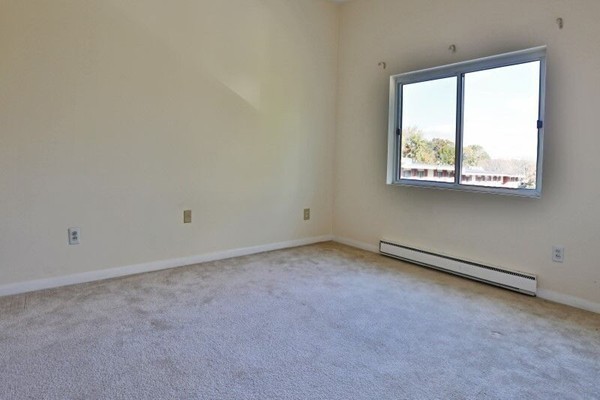 74 Beach Street, Unit 211 Woburn, MA 01801 - Photo 9 of 14 an empty room with a window