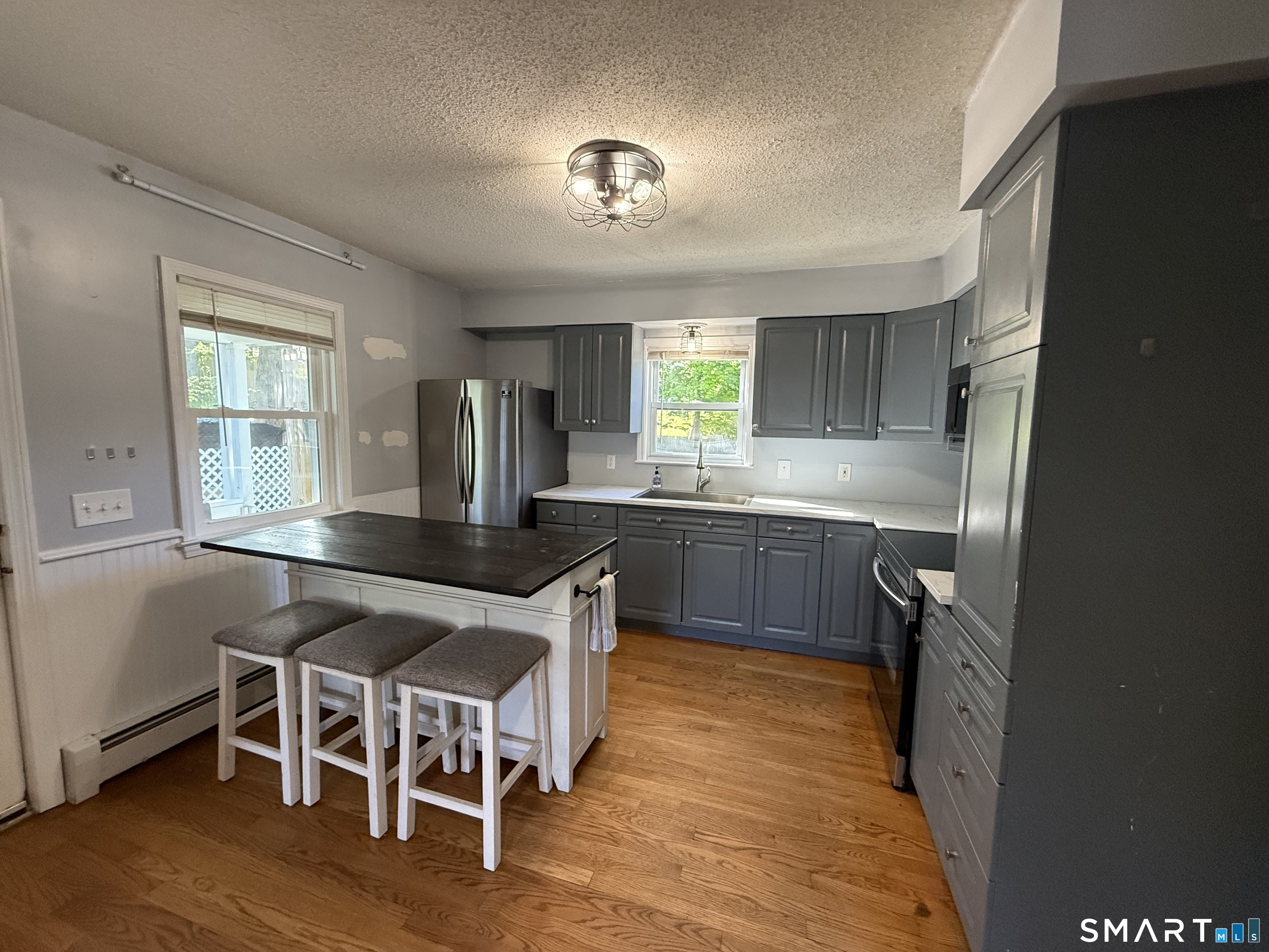 808 East Main Street Torrington, CT 06790 - Photo 13 of 40 a kitchen with granite countertop a sink appliances and cabinets