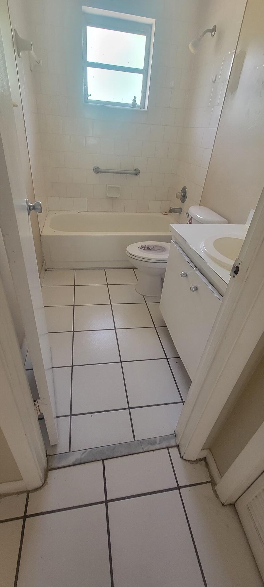 5926-5934 Taft Street Hollywood, FL 33021 - Photo 10 of 13 a bathroom with a sink toilet and bathtub