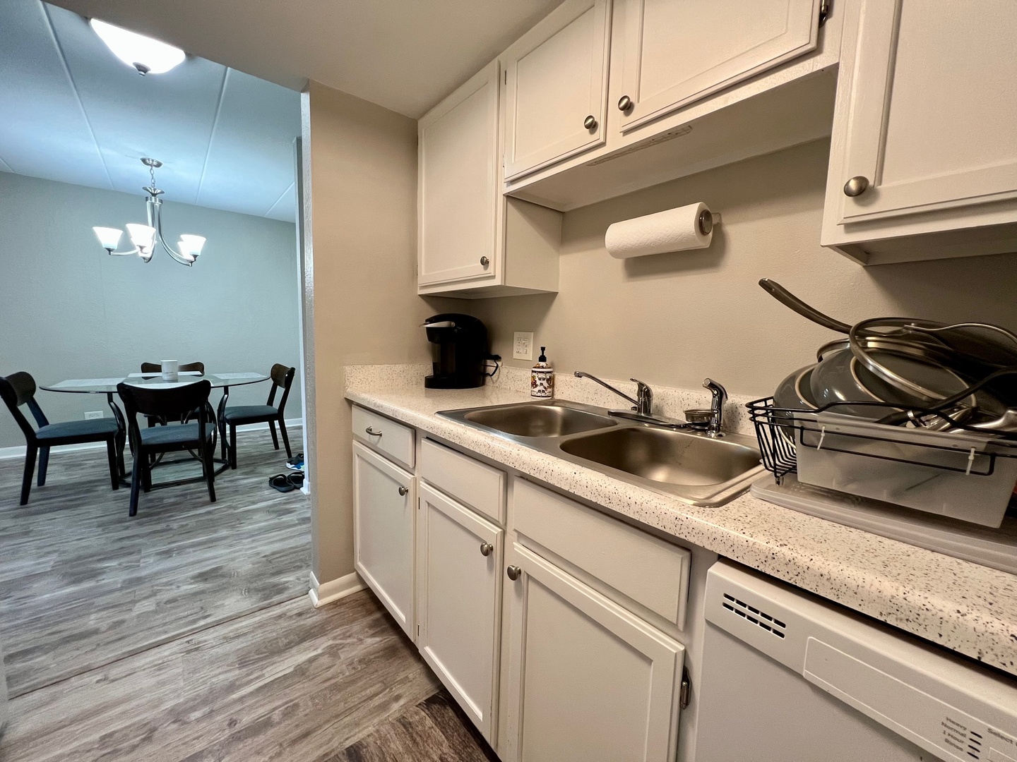 1 Renaissance Place, Unit 719 Palatine, IL 60067 - Photo 18 of 34 a kitchen with stainless steel appliances granite countertop a sink dishwasher a stove and cabinets with wooden floor