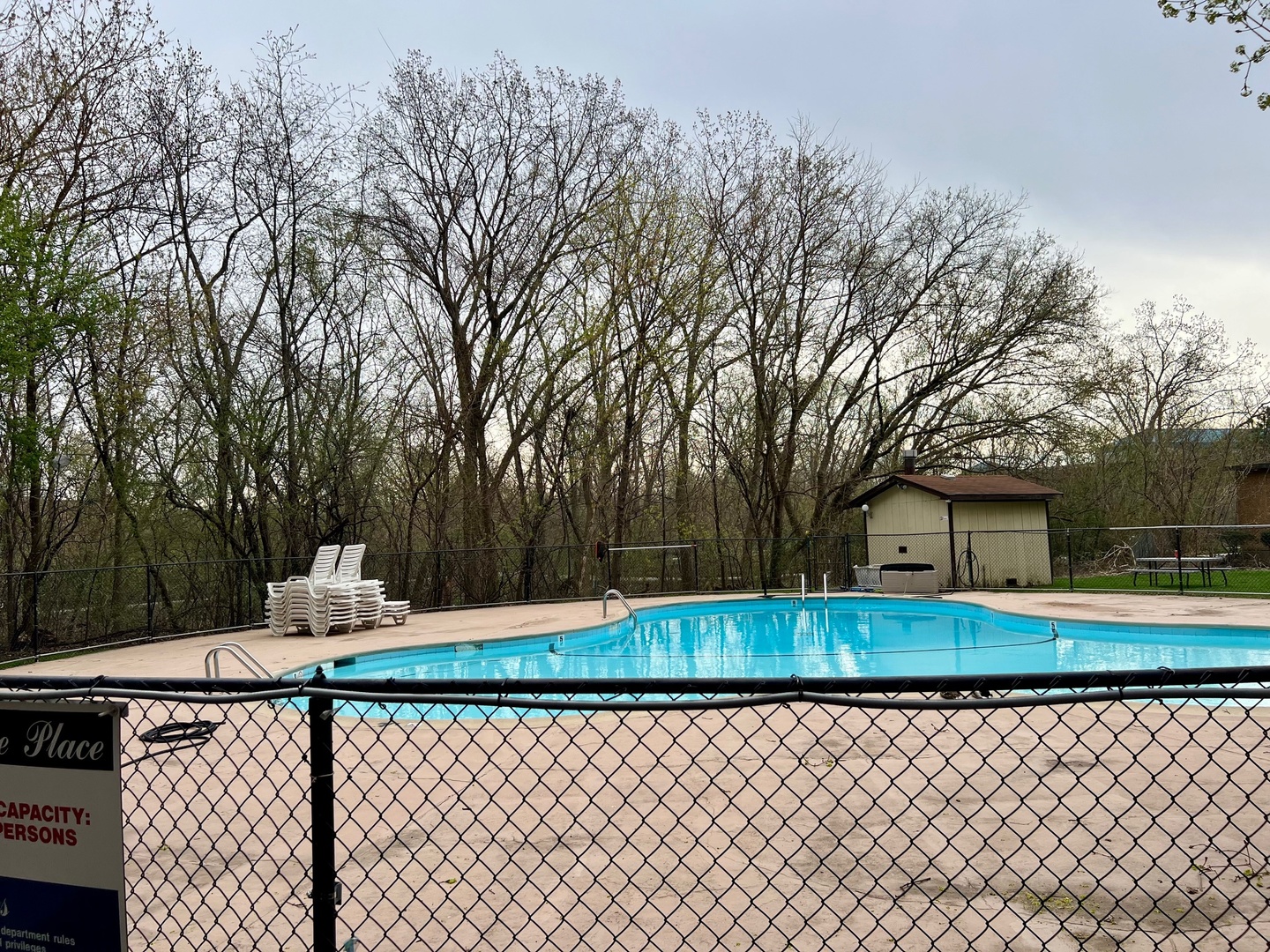 1 Renaissance Place, Unit 719 Palatine, IL 60067 - Photo 33 of 34 a front view of a house with swing yard and large trees