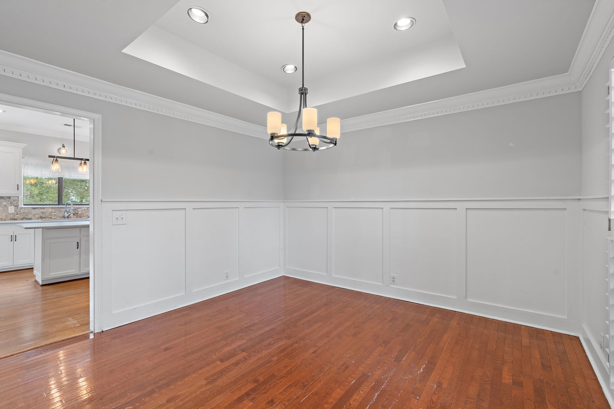 6916 Sunderland Circle Nashville, TN 37221 - Photo 11 of 43 a view of a room with wooden floor and ceiling fan