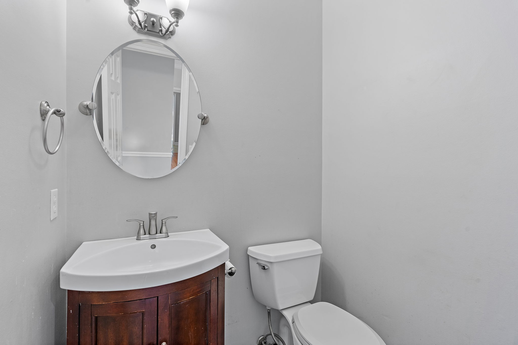 6916 Sunderland Circle Nashville, TN 37221 - Photo 13 of 43 a bathroom with a toilet a sink and mirror
