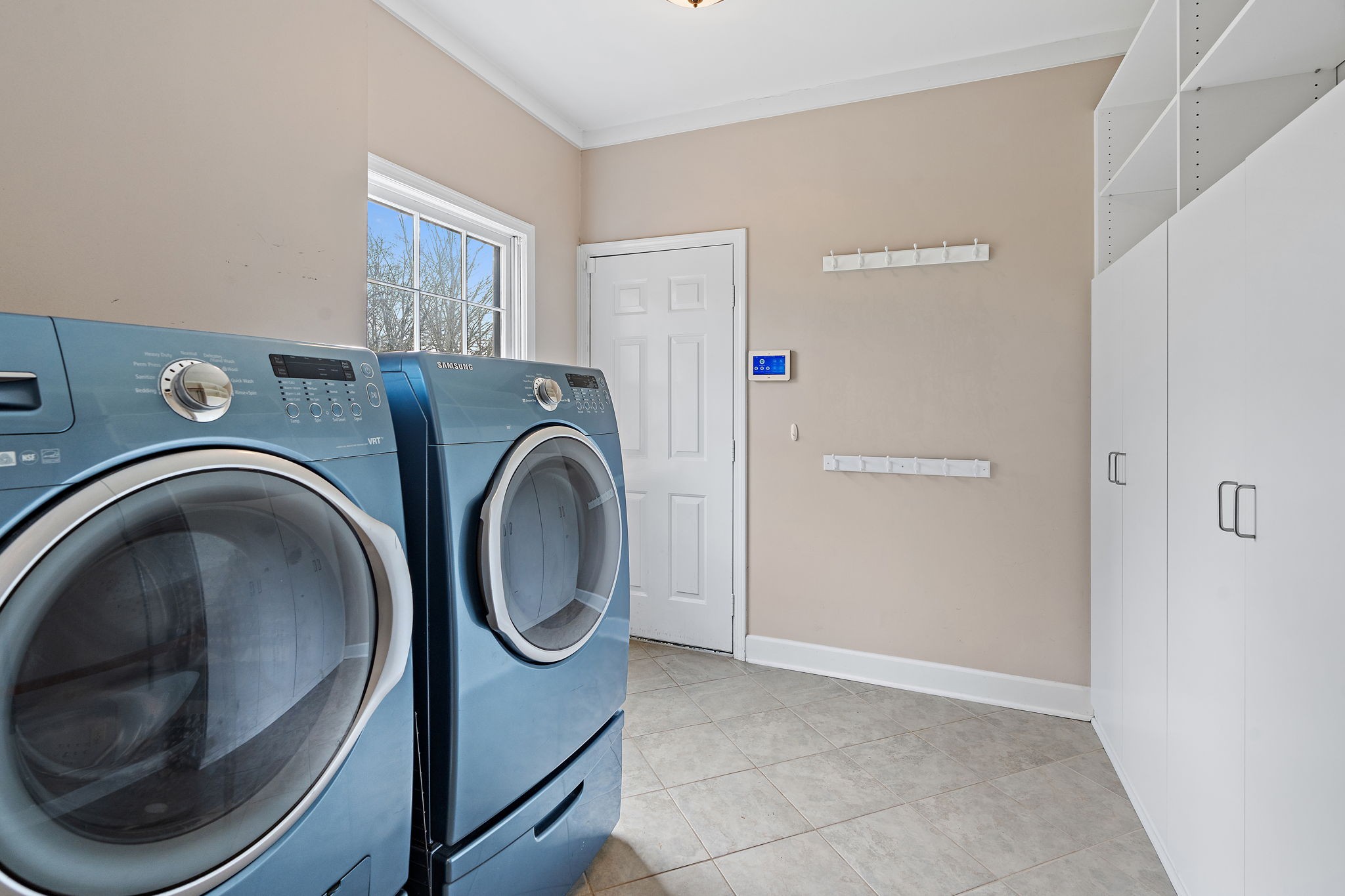 6916 Sunderland Circle Nashville, TN 37221 - Photo 17 of 43 a utility room with dryer and washer