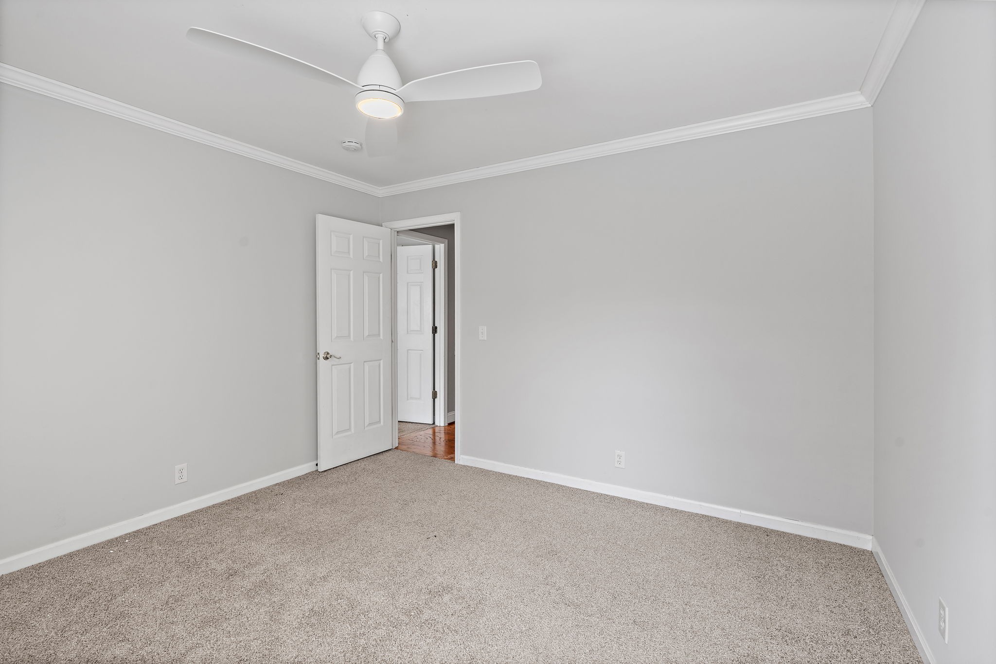 6916 Sunderland Circle Nashville, TN 37221 - Photo 24 of 43 an empty room with a ceiling fan and a window