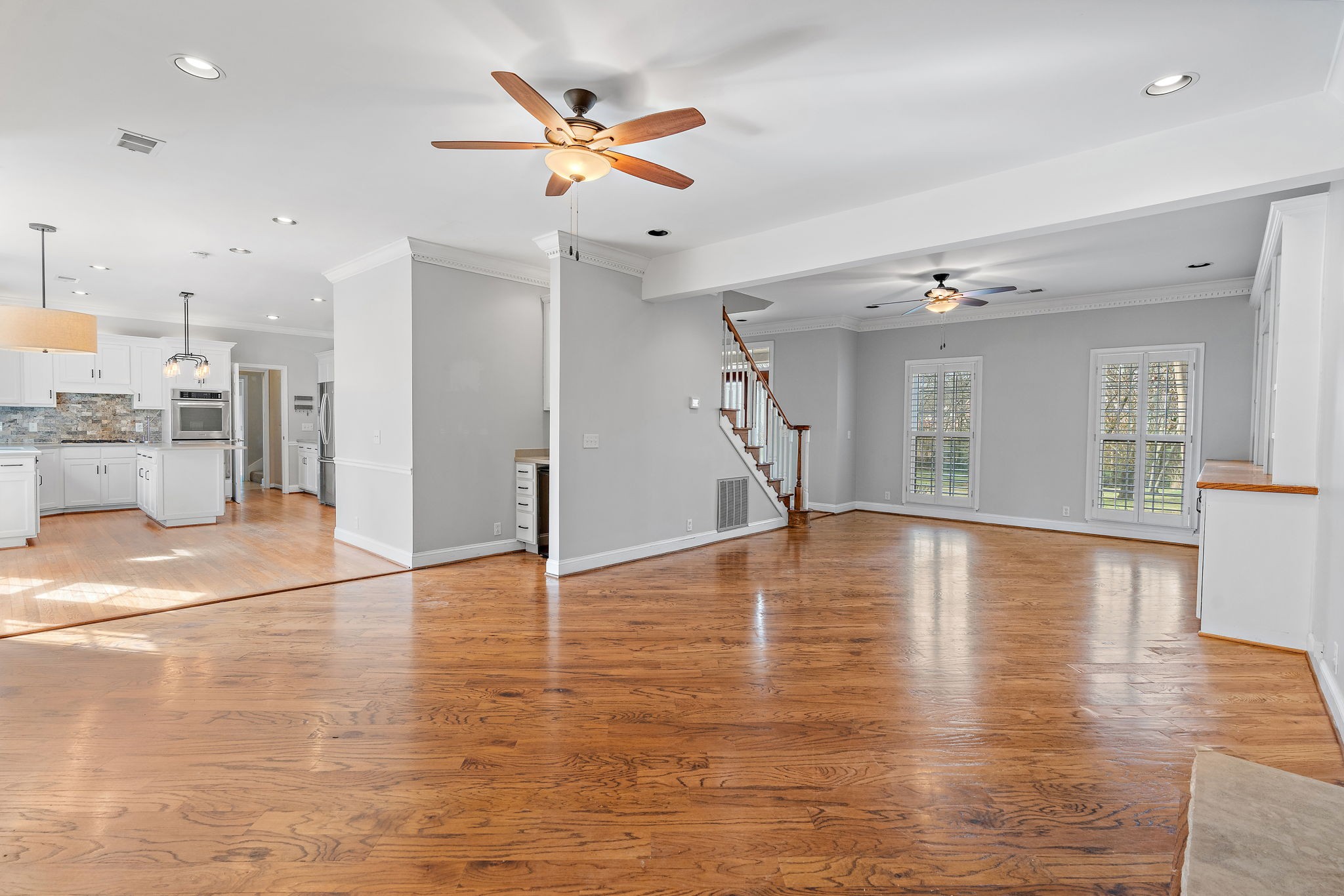 6916 Sunderland Circle Nashville, TN 37221 - Photo 8 of 43 a view of empty room with wooden floor and ceiling fan