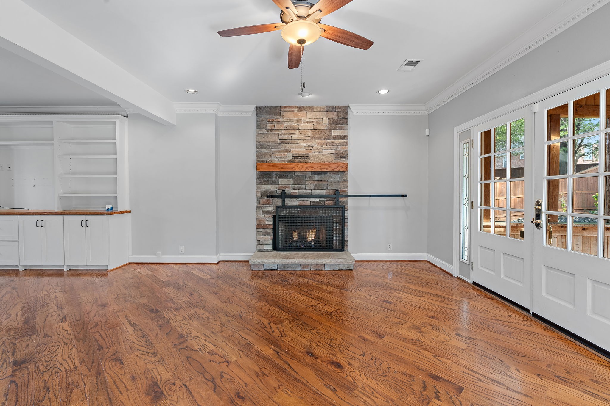 6916 Sunderland Circle Nashville, TN 37221 - Photo 9 of 43 a view of an empty room with window and wooden floor