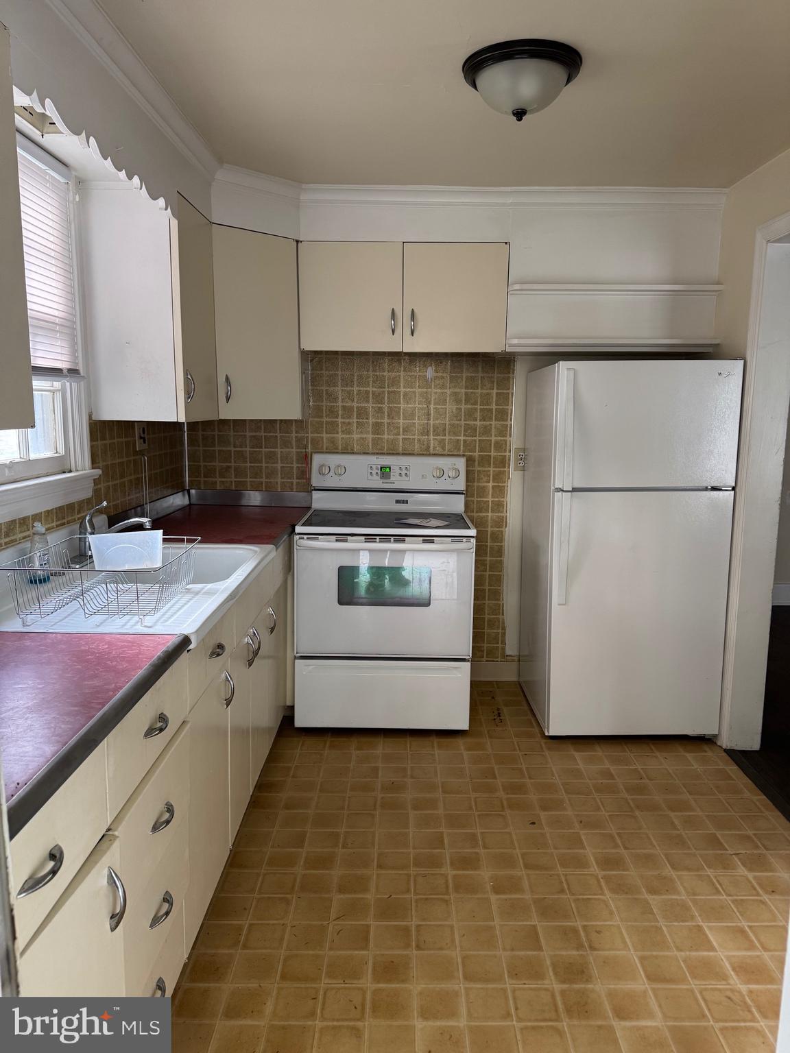 117 East State Street, Unit 1 Quarryville, PA 17566 - Photo 2 of 6 a kitchen with stainless steel appliances a stove a sink and a refrigerator