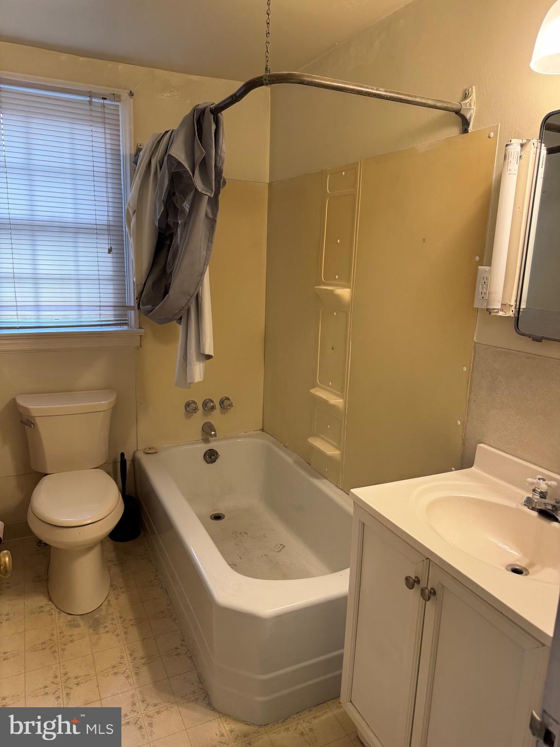 117 East State Street, Unit 1 Quarryville, PA 17566 - Photo 5 of 6 a bathroom with a sink a toilet and shower