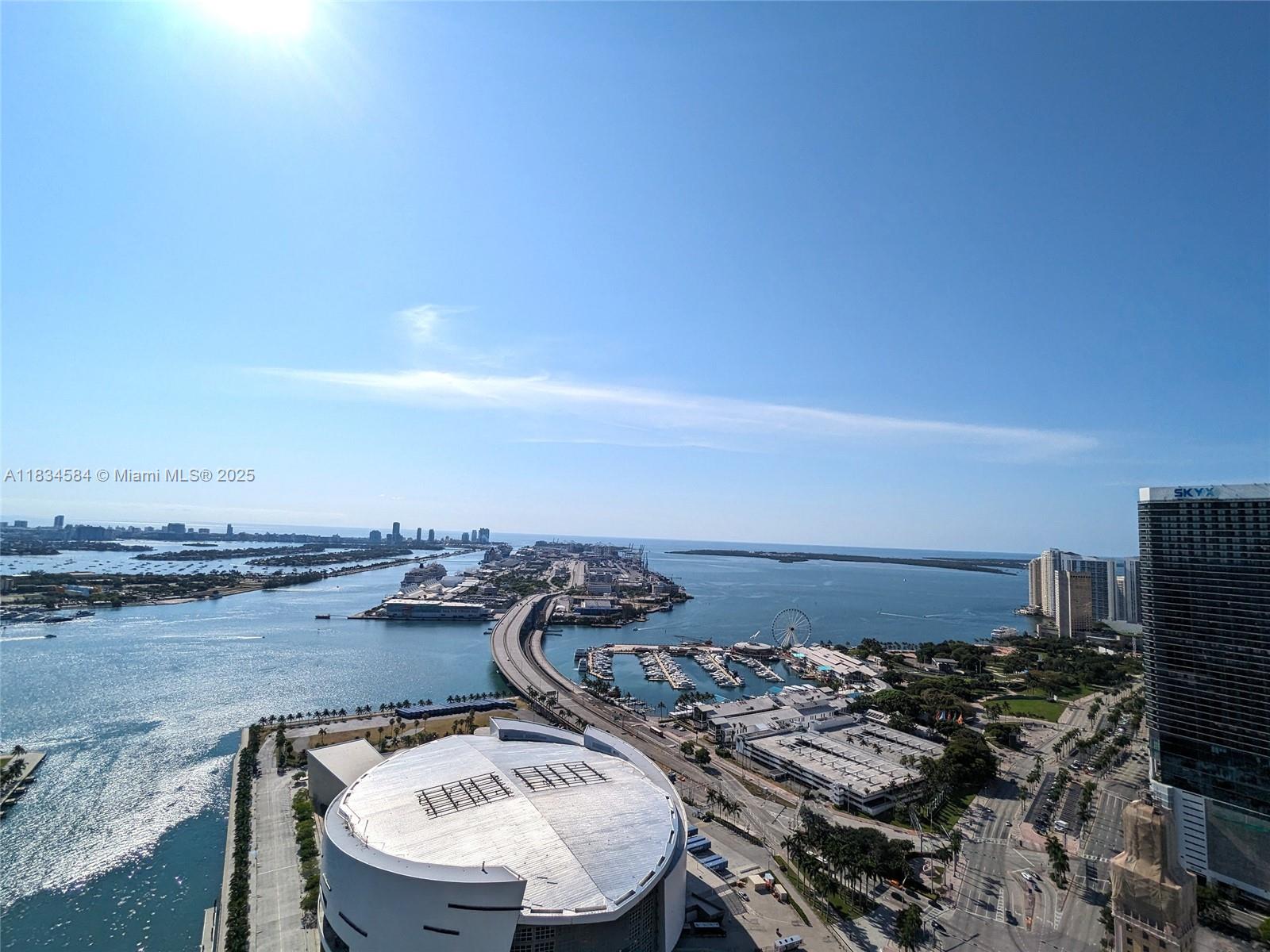 888 Biscayne Boulevard, Unit 4702 Miami, FL 33132 - Photo 16 of 27 a view of a terrace with lawn chairs
