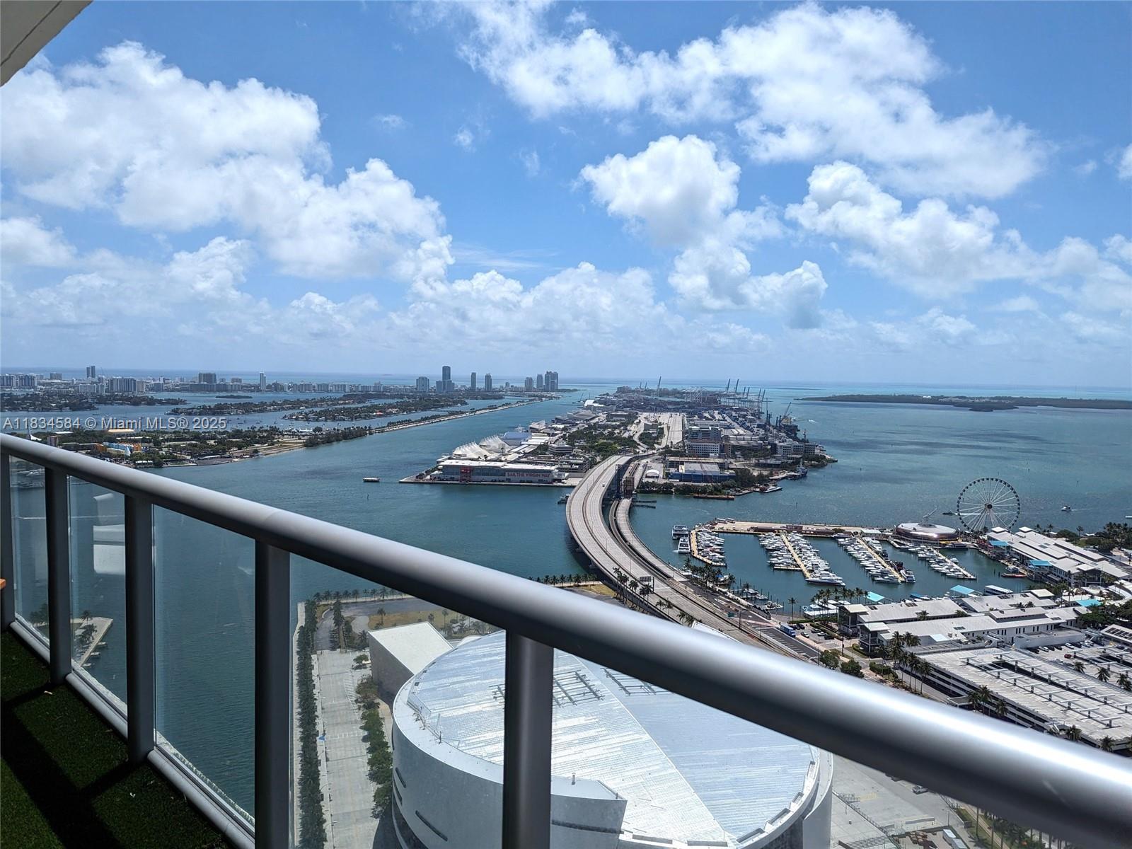 888 Biscayne Boulevard, Unit 4702 Miami, FL 33132 - Photo 19 of 27 a view of a balcony next to a yard
