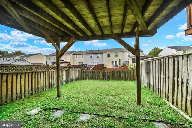 a view of a backyard with a small cabin