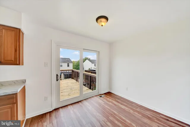 a view of a livingroom with wooden floor
