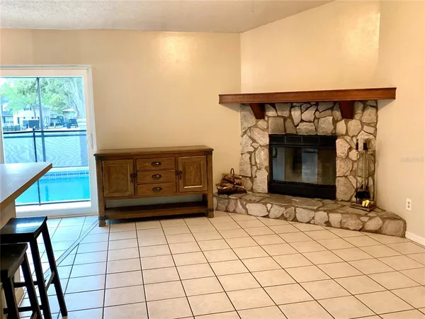 a view of an empty room with a fireplace