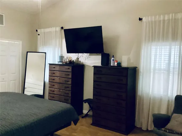 a bedroom with a bed and furniture