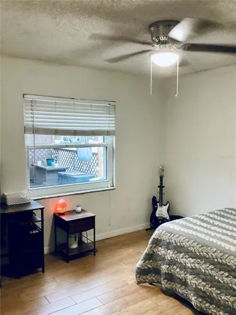 a bedroom with a bed and a table