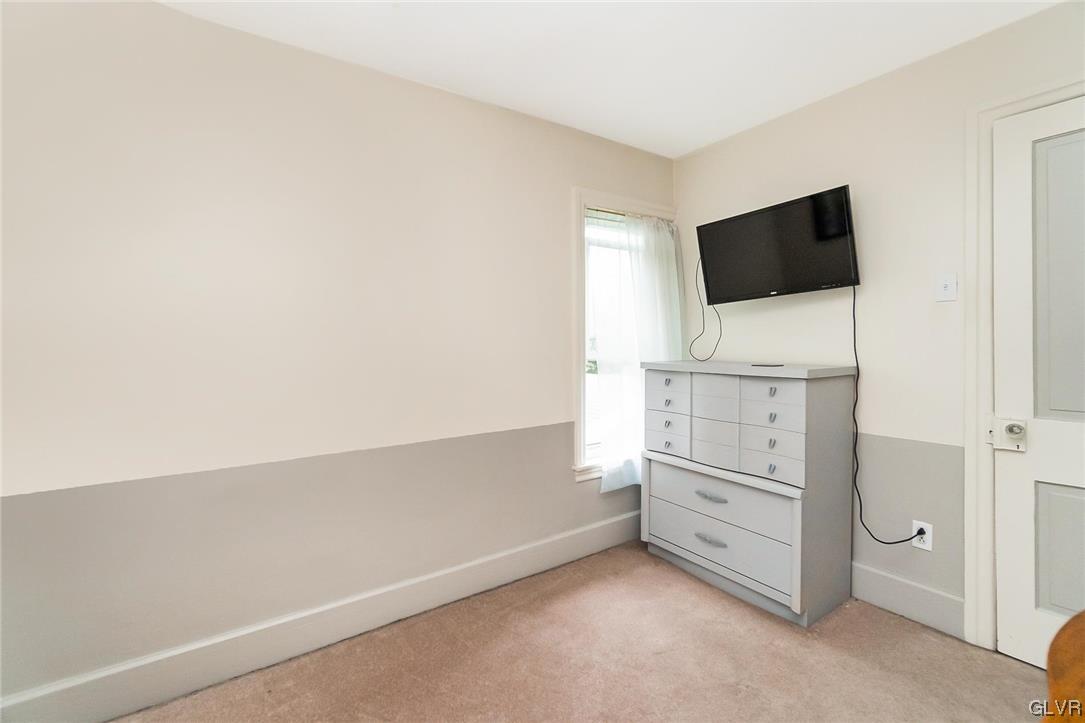 568 Bushkill Center Road Nazareth, PA 18064 - Photo 22 of 45 a room with white cabinets and flat screen tv