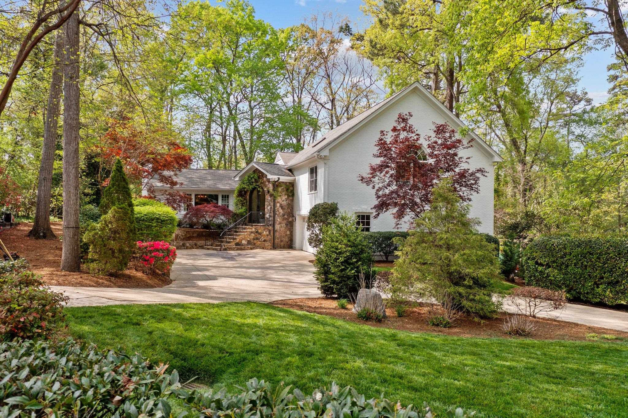 3132 Eton Road Raleigh, NC 27608 - Photo 67 of 74 a view of a backyard with plants and a large tree