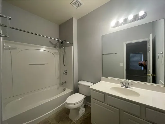 an empty room with a empty space and windows