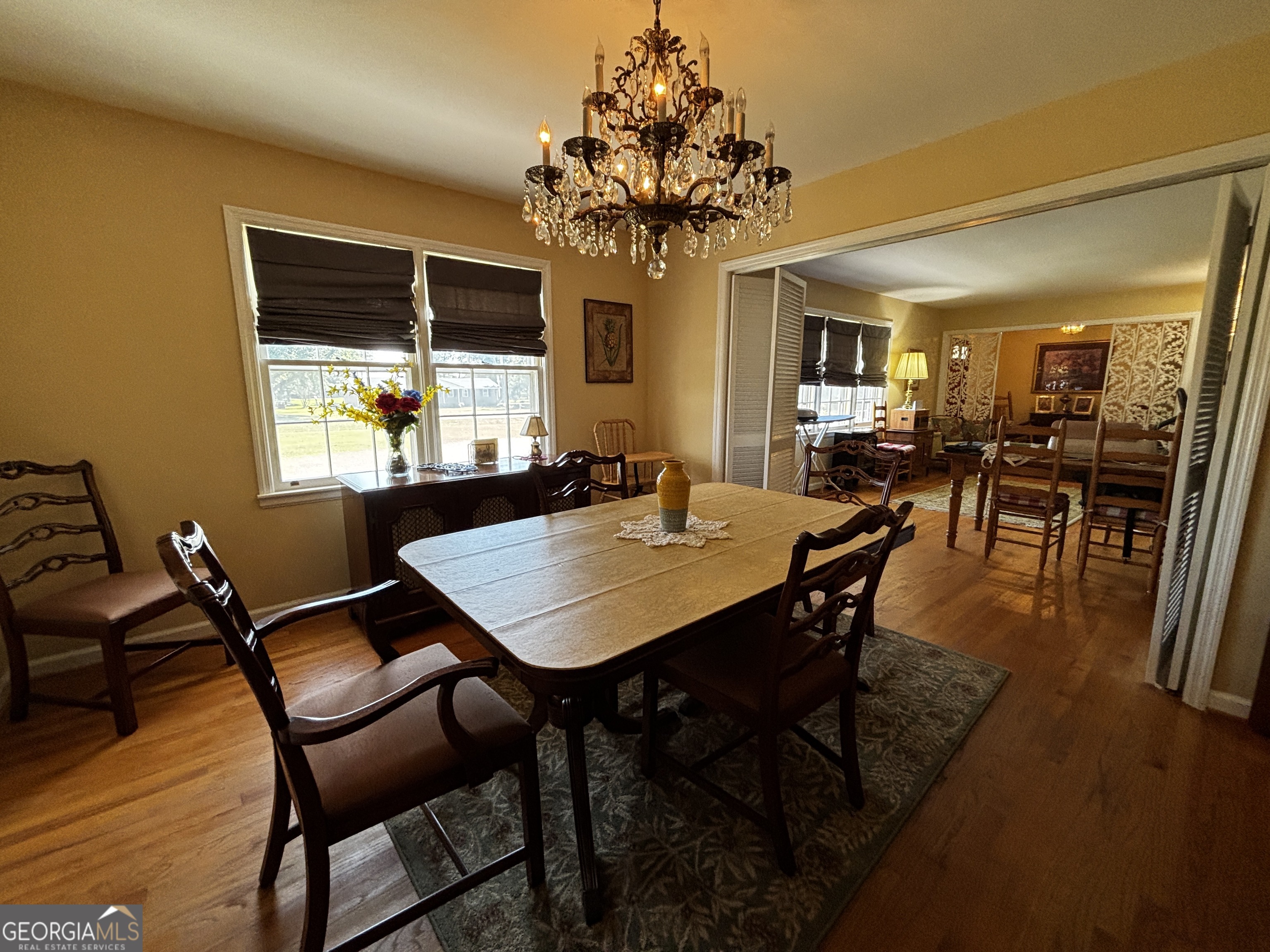 207 Old Thomson Road Wrens, GA 30833 - Photo 16 of 46 a view of a dining room with furniture and chandelier