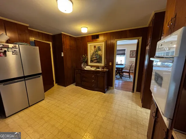 a kitchen with stainless steel appliances a refrigerator and a sink