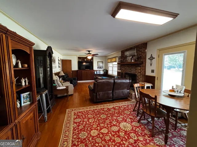a living room with furniture fireplace and a window