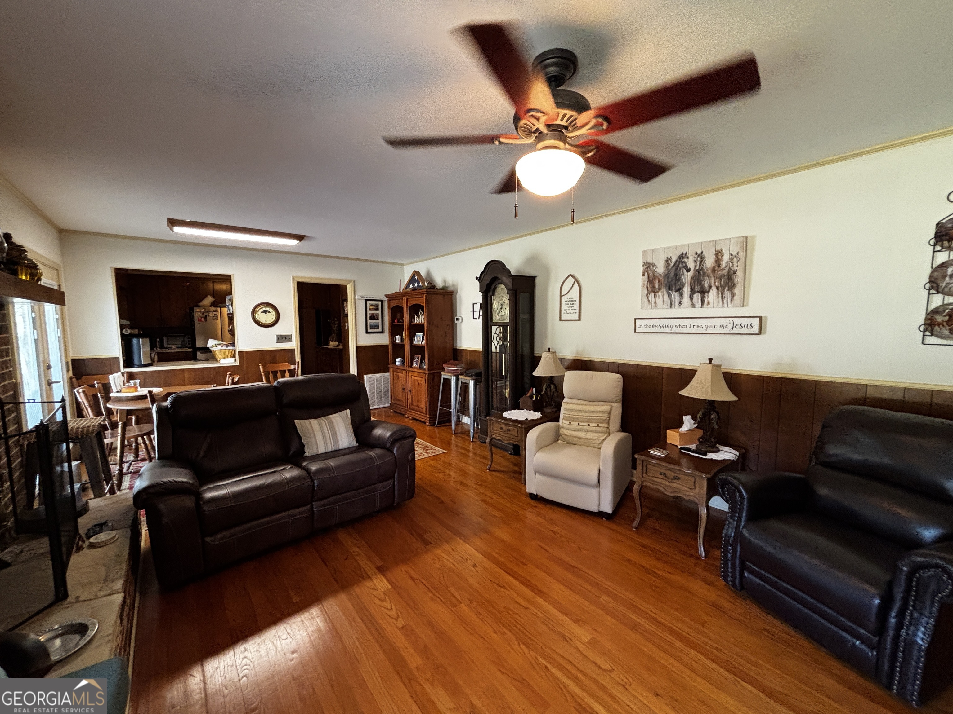 207 Old Thomson Road Wrens, GA 30833 - Photo 21 of 46 a living room with furniture and a flat screen tv with wooden floor