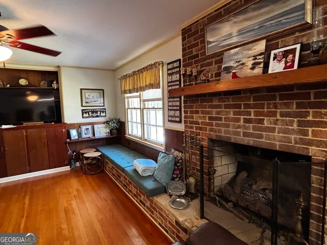 a living room with furniture flat screen tv and a fireplace