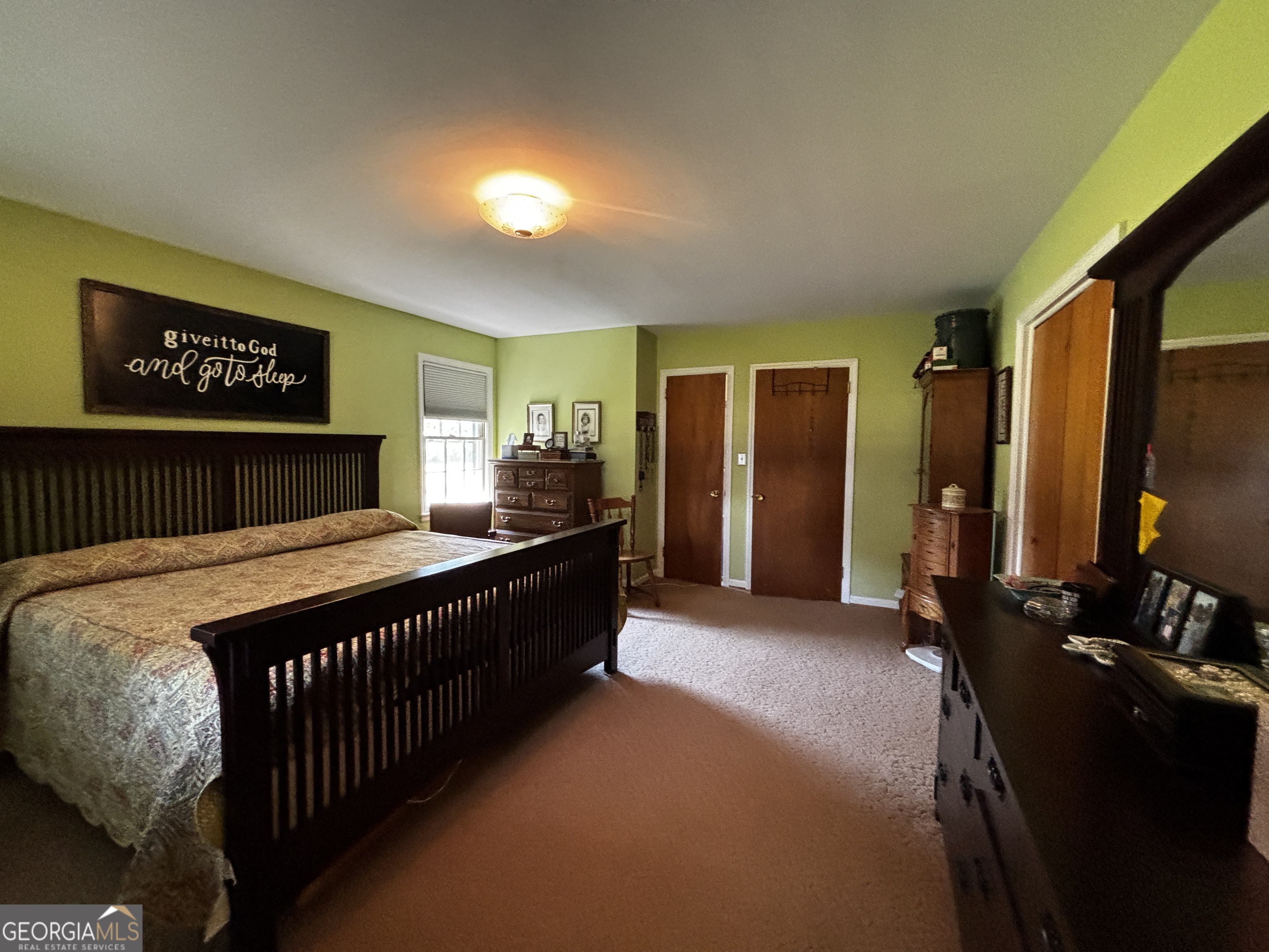 207 Old Thomson Road Wrens, GA 30833 - Photo 25 of 46 a bedroom with bed and dresser