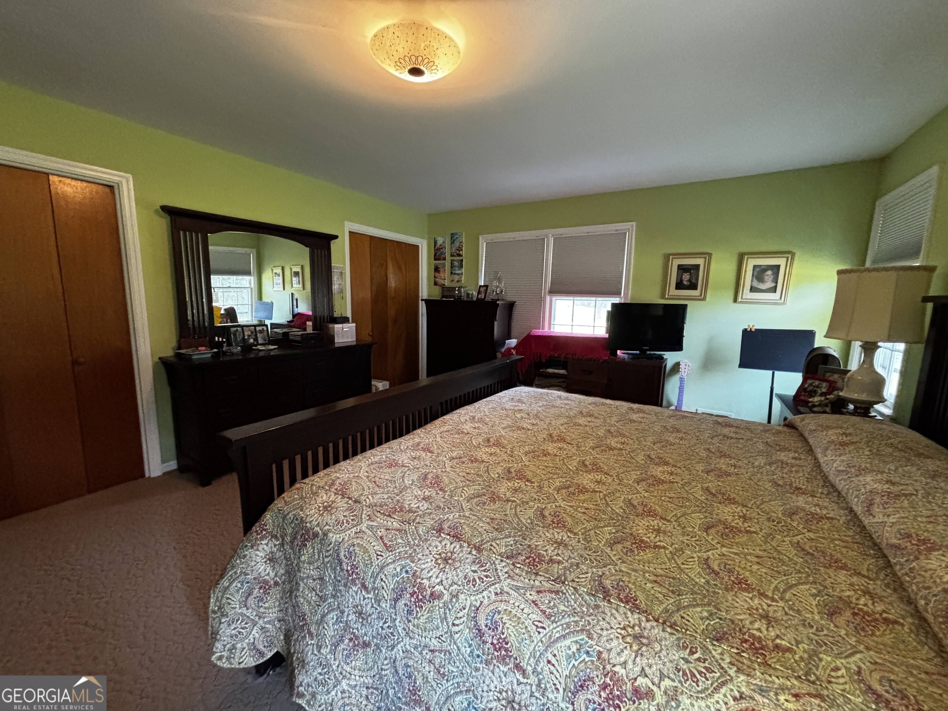 207 Old Thomson Road Wrens, GA 30833 - Photo 26 of 46 a bed sitting in a spacious bedroom next to a window and dresser