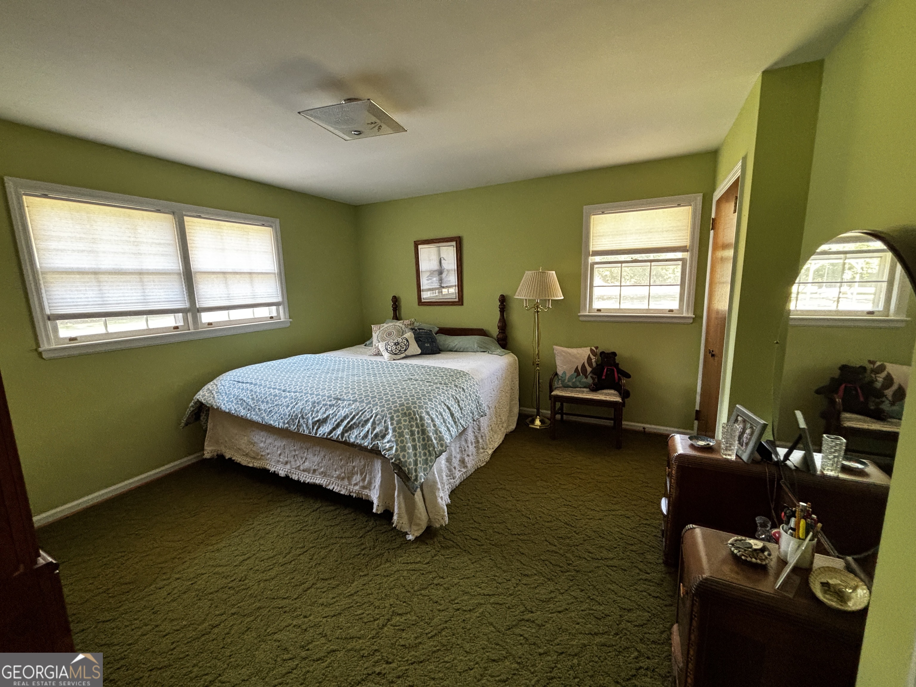 207 Old Thomson Road Wrens, GA 30833 - Photo 28 of 46 a bedroom with a bed wooden floor and window