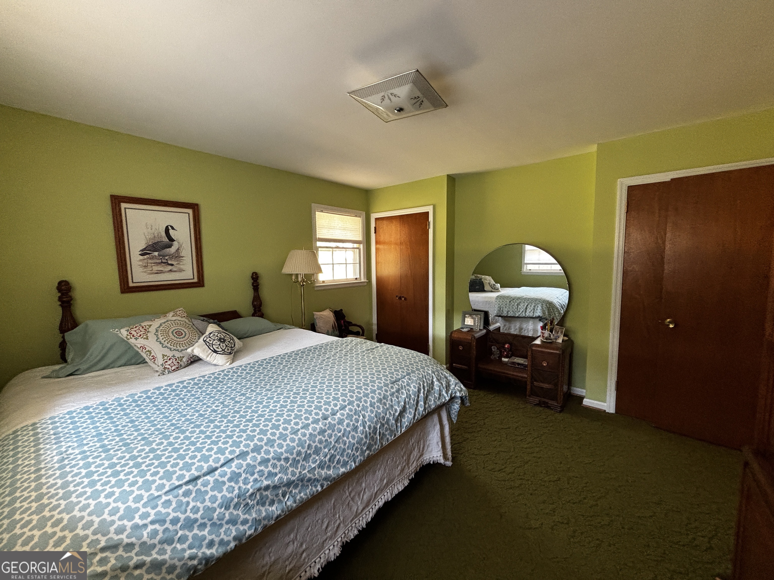 207 Old Thomson Road Wrens, GA 30833 - Photo 29 of 46 a bedroom with a bed and painting on the wall