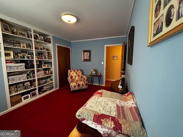 a bedroom with a bed and a closet