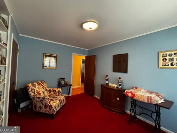 a bedroom with furniture and a window
