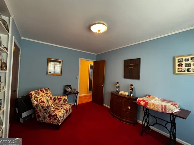 a bedroom with furniture and a window