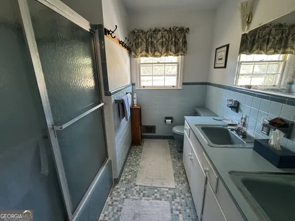 a kitchen with refrigerator and window