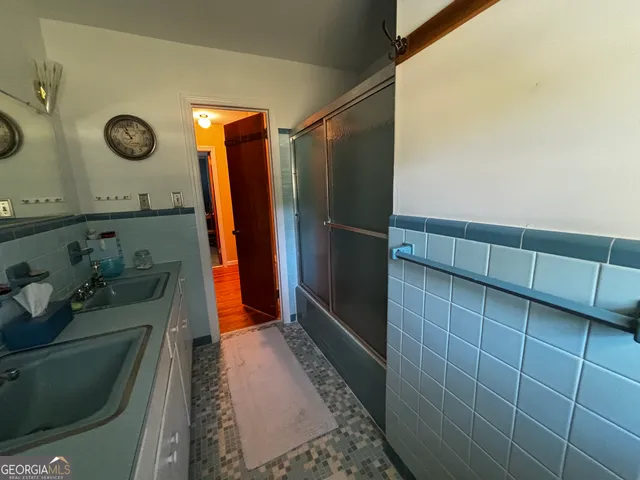 a bathroom with a sink and mirror