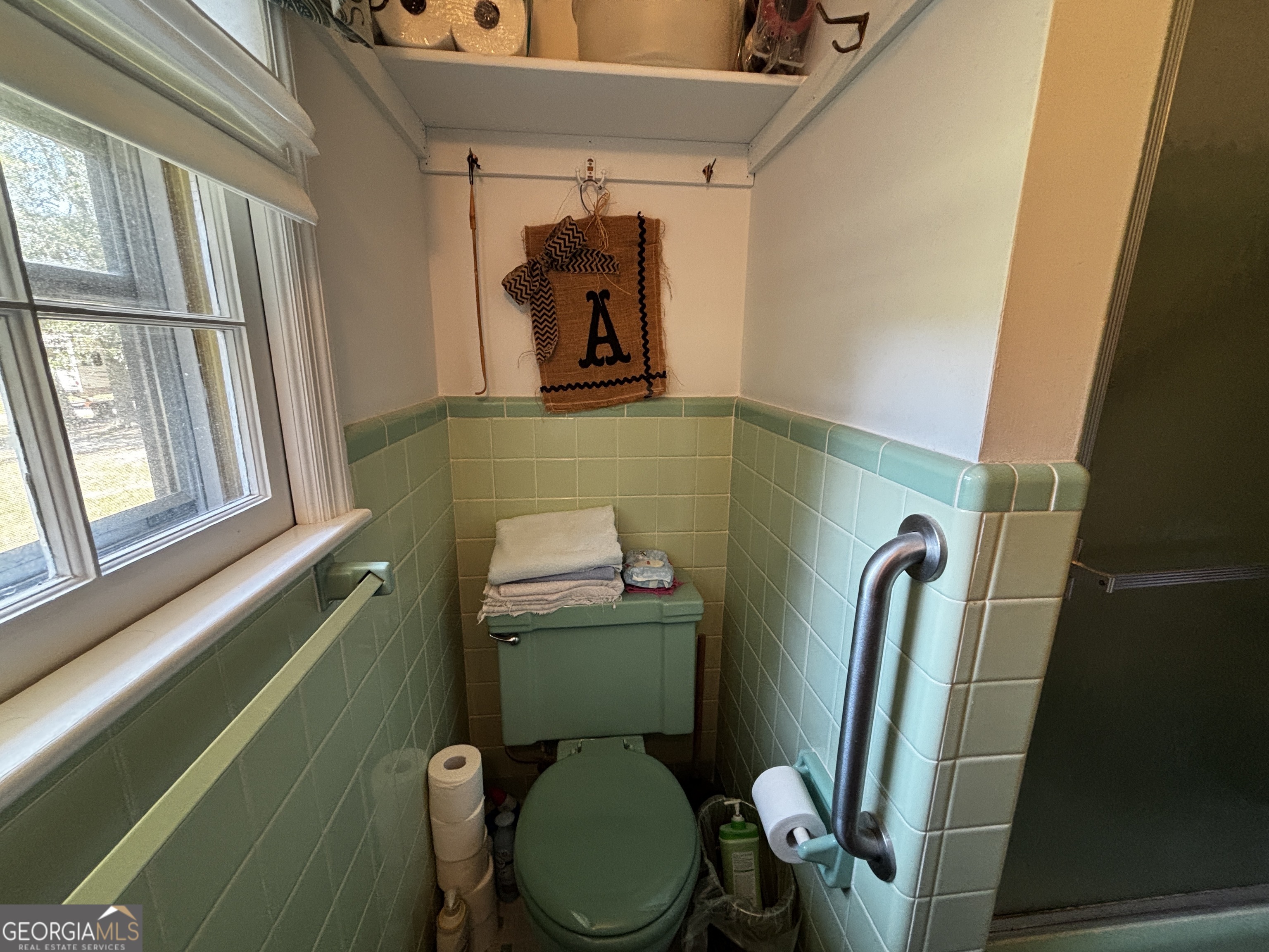 207 Old Thomson Road Wrens, GA 30833 - Photo 38 of 46 a bathroom with a toilet sink and mirror