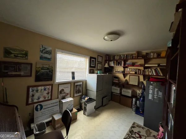 a view of a workspace with furniture
