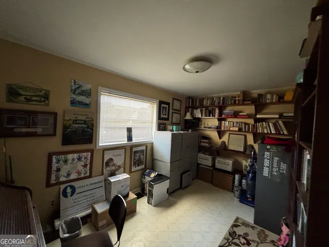 a view of a workspace with furniture