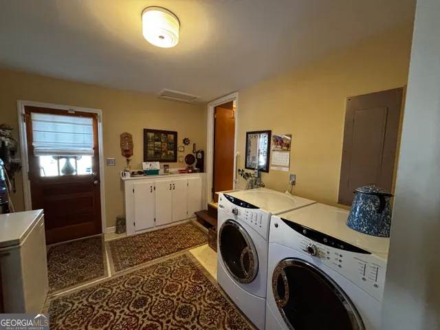 a utility room with dryer and washer