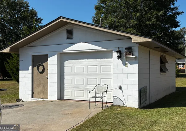 a front view of a house with garage