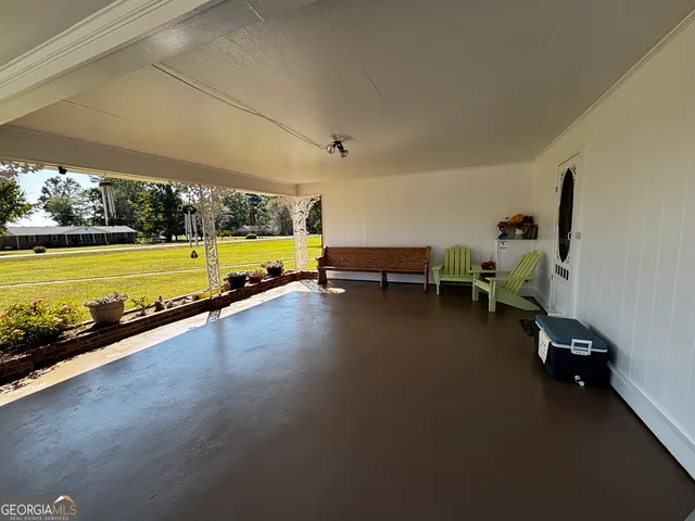 a swimming pool with outdoor seating and yard