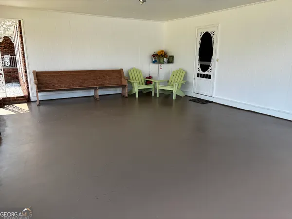 a bedroom with furniture and window