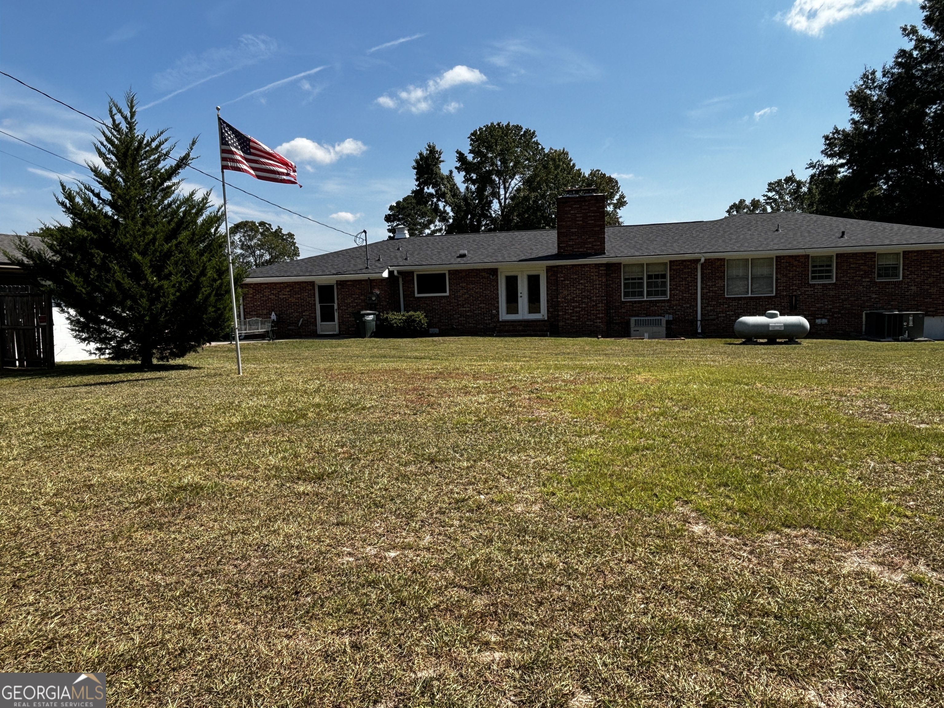 207 Old Thomson Road Wrens, GA 30833 - Photo 5 of 46 a front view of house with yard and trees