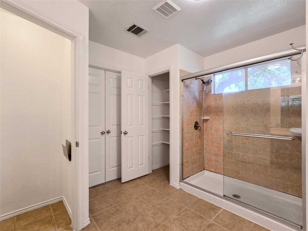 8021 Rimini Trail Austin, TX 78729 - Photo 20 of 26 a bathroom with a shower and a sink